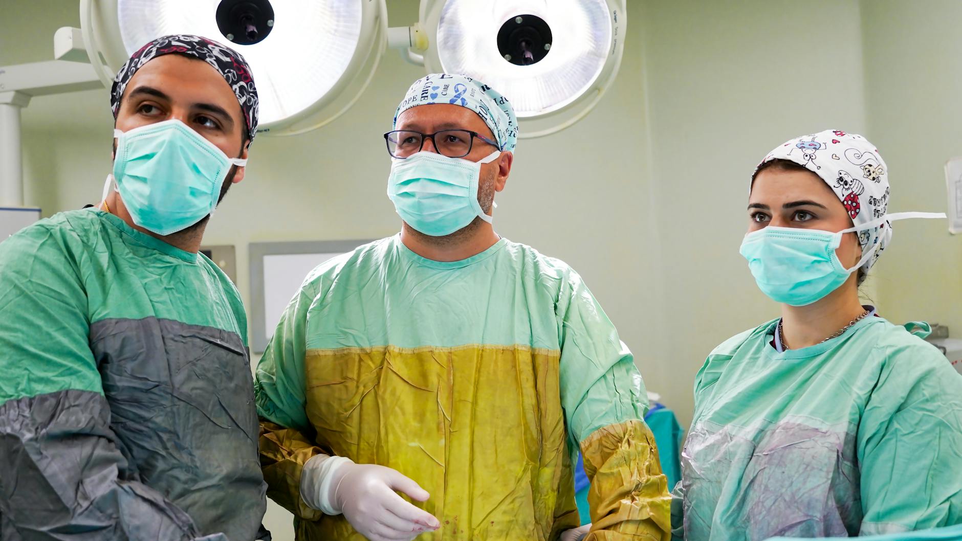 team of surgeons wearing masks looking